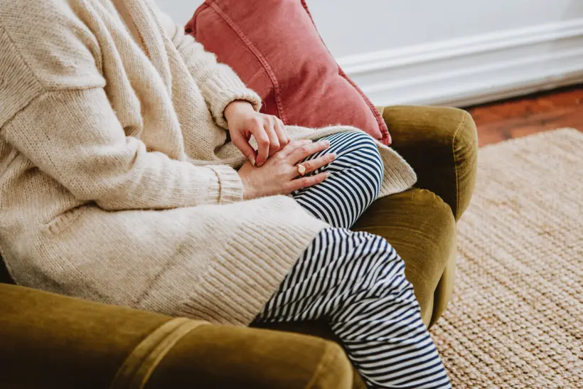 A client seated comfortably during a confidential therapy appointment