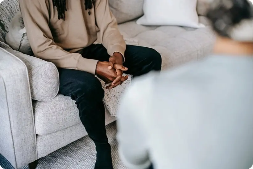 Two people in a quiet, supportive counselling conversation